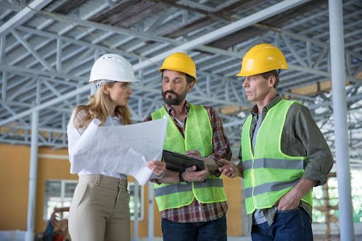 contractor with workers and documents